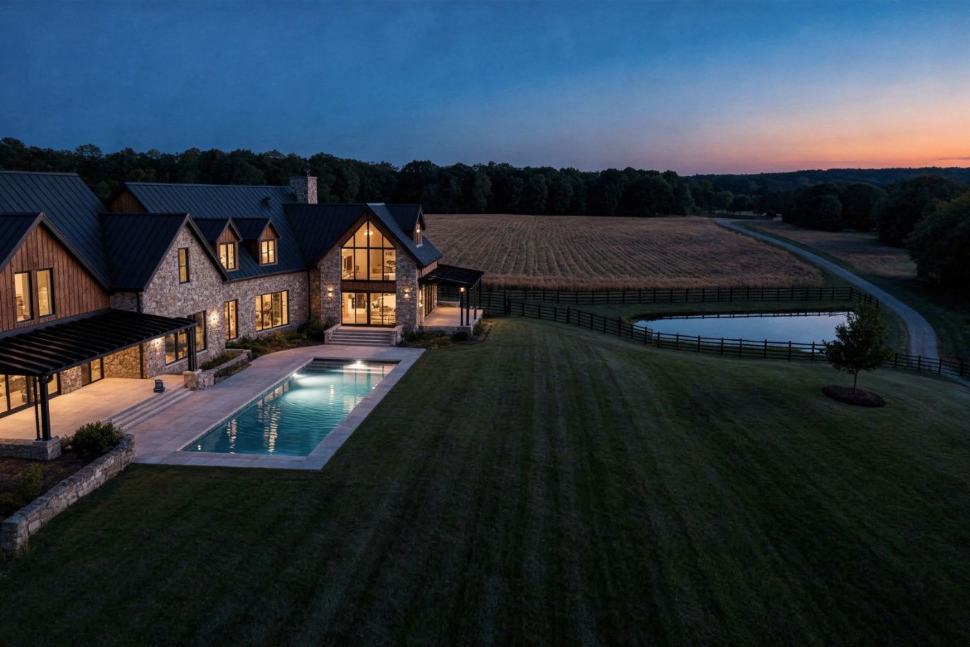 Aerial of the outdoor room and pool at dusk, artist's concept